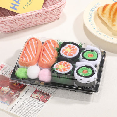 Chaussettes sushi Velora Makisu dans leur boîte à emporter